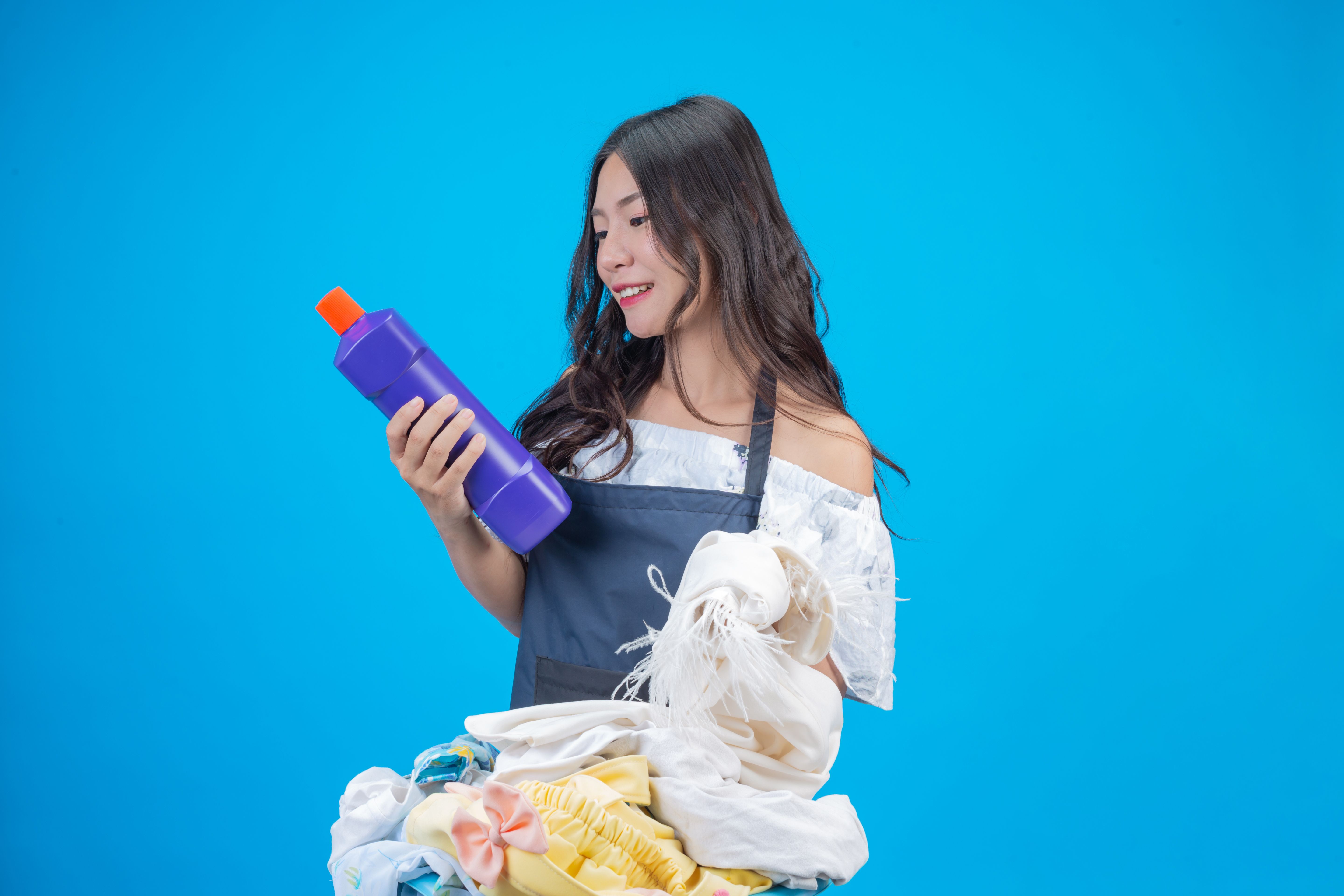 beautiful-woman-holding-cloth-liquid-detergent-prepared-washing-blue.jpg